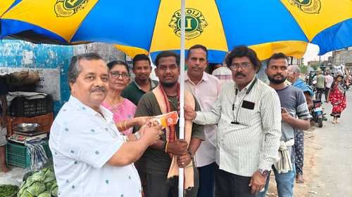 Umbrella distribution by LC Kabisurya Nagar